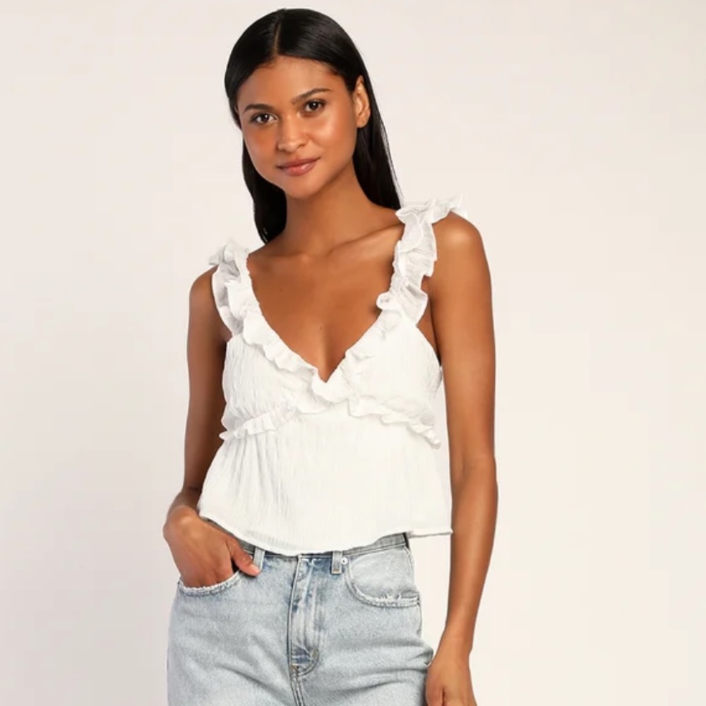 Viral Lulu’s “Right to Romance Ivory Sleeveless Ruffled Tie-Back Top”